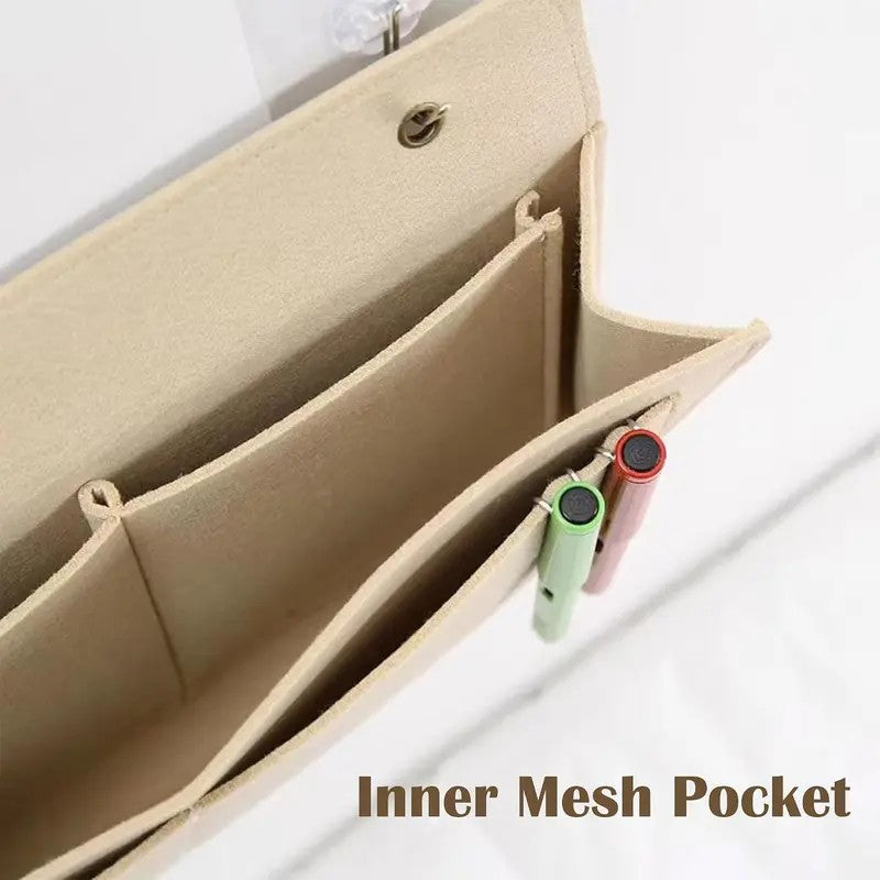 Close-up of the main compartment, divided pockets and inner mesh pockets of the bedside caddy